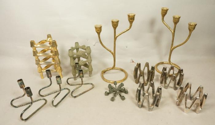 Lot 261  -  Lot Modernist Metal Candleholders. Includes DANSK, NAGLE, Brass, Silver Plate. Some stacking. Some with boxes.-- Dimensions:  H: 12 inches: W: 7 inches --- 