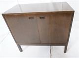 Lot 305  -  DUNBAR Dark Wood Bar. Lift Top Bar Cabinet. Top lifts to reveal white laminate interior. Some cork lined areas. Not marked.-- Dimensions:  H: 32.75 inches: W: 36 inches: D: 18 inches --- 