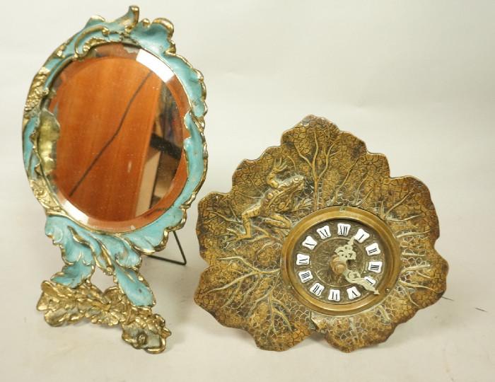 Lot 309  -  2pc Vintage Metal Lot. Painted & Gilt Metal Table Mirror. A frame stand. Blue paint accents.  Vintage Brass A Frame Frog on Lilly pad Clock. -- Dimensions:  H: 11.5 inches: W: 8.25 inches --- 