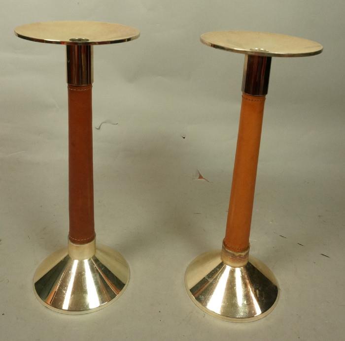 Lot 320  -  Pair Ralph Lauren Leather Rapped Candlesticks.  Gold tone metal with leather rapped columns.-- Dimensions:  H: 14 inches: W: 5.5 inches --- 