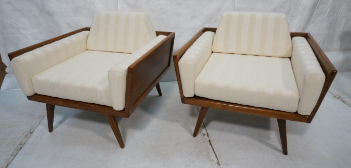 Lot 322  -  Pair American Modern Walnut Lounge Chairs.  Angled even arm frame on tapered legs.  -- Dimensions:  H: 28 inches: W: 33.25 inches: D: 32 inches --- 