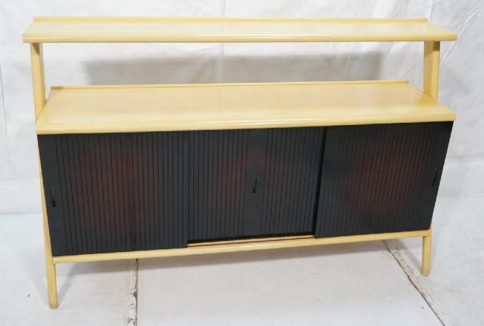 Lot 330  -  50's Modern Sideboard Buffet.  Blond wood with Black Lacquer Doors.  Open tier top.  Sliding doors.  Interior drawers and shelves.-- Dimensions:  H: 43 inches: W: 66.25 inches: D: 18.5 inches --- 