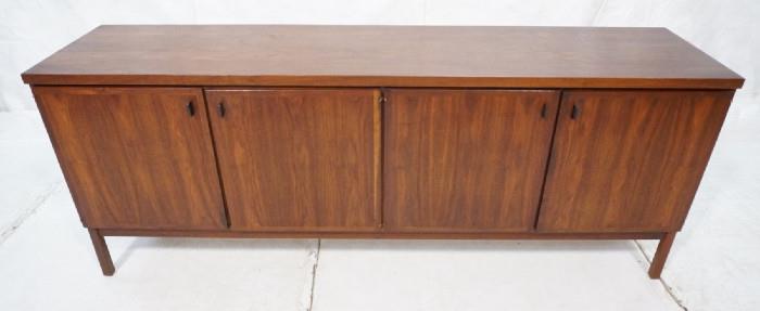 Lot 357  -  American Modern Walnut Sideboard Credenza.  Baughman style with 4 doors and black metal pulls.-- Dimensions:  H: 30.25 inches: W: 77.75 inches: D: 18 inches --- 