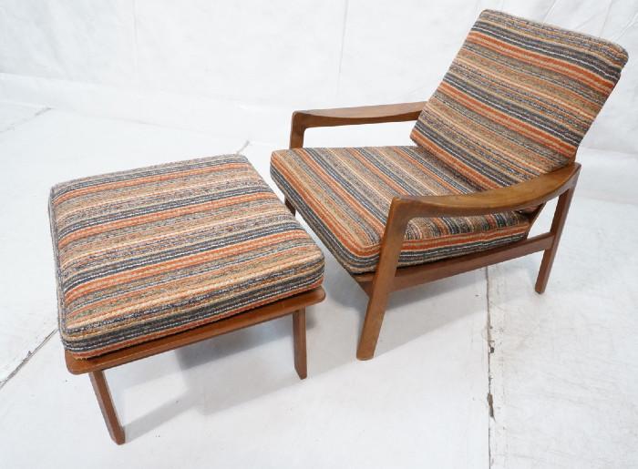 Lot 371  -  Norway Modern Teak Lounge Chair and Ottoman.  Wide arms. Angled frame.-- Dimensions:  H: 31 inches: W: 29 inches: D: 33.5 inches --- 