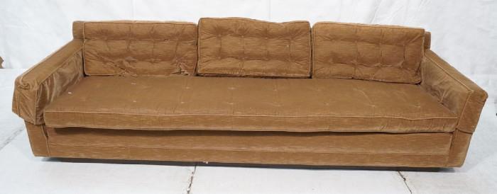 Lot 372  -  Milo Baughman Attributed Couch Sofa.  Brown Velour with tufted back cushions.  Low profile. Black recessed base.-- Dimensions:  H: 29 inches: W: 99 inches: D: 33 inches --- 