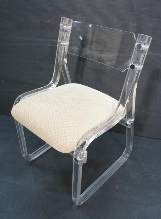 Lot 373  -  Lucite CARL SPRINGER Attribution Side Chair. Upholstered cushion seat. Chrome accent mounting hardware. Thick lucite curved form frame.-- Dimensions:  H: 32 inches: W: 21 inches: D: 22 inches --- 