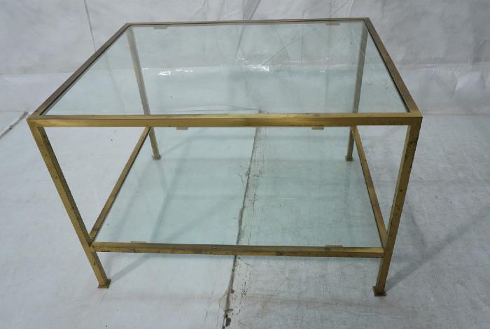 Lot 374  -  Paul McCOBB style Two Tier Brass Occasional Table. Two inset glass levels. Square tube brass frame. -- Dimensions:  H: 22 inches: W: 26 inches: D: 32 inches --- 