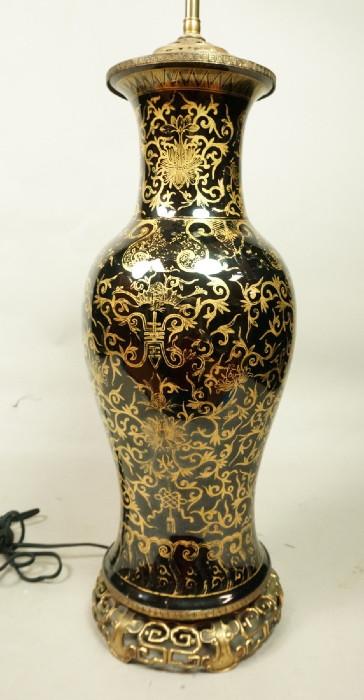 Lot 376  -  Chinese Export style Table Lamp. Black urn form with elaborate hand painted gold design. Beautiful bronze Asian style mounts. -- Dimensions:  H: 35 inches: W: 7.5 inches --- 