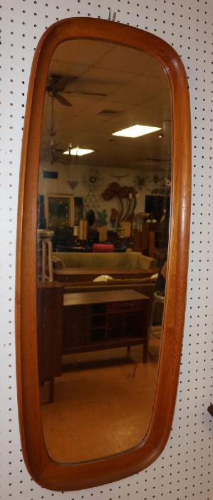 Lot 383  -  Danish Modern Teak Wall Mirror. Vertical Form with curved edges. Marked Made in Denmark-- Dimensions:  H: 43.25 inches: W: 17 inches: D: 25 inches --- 