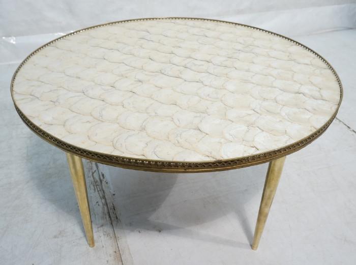 Lot 437  -  Capiz Shell Decorator Round Cocktail Table. Brass gallery trim. Tapered metal peg legs. -- Dimensions:  H: 20.25 inches: W: 36.25 inches --- 