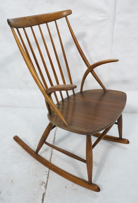 Lot 440  -  GYNGESTOL NR. 3 Danish Modern Walnut Rocker Rocking Chair. Bowed Arms. Spindle Back. Marked: N. EILERSEN SKAMBY ARKITEKT WIKKELSE. -- Dimensions:  H: 37.25 inches: W: 22.5 inches: D: 19 inches --- 