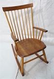 Lot 441  -  THOMAS MOSER Cabinetmakers Rocker Rocking Chair. American Modern. Two Tone. Spindle Back. Marked: Thos. Moser Cabinetmakers Auburn, Maine, 1994, Chuck Jones.-- Dimensions:  H: 38.75 inches: W: 22.75 inches: D: 33 inches --- 
