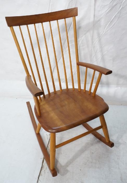 Lot 441  -  THOMAS MOSER Cabinetmakers Rocker Rocking Chair. American Modern. Two Tone. Spindle Back. Marked: Thos. Moser Cabinetmakers Auburn, Maine, 1994, Chuck Jones.-- Dimensions:  H: 38.75 inches: W: 22.75 inches: D: 33 inches --- 