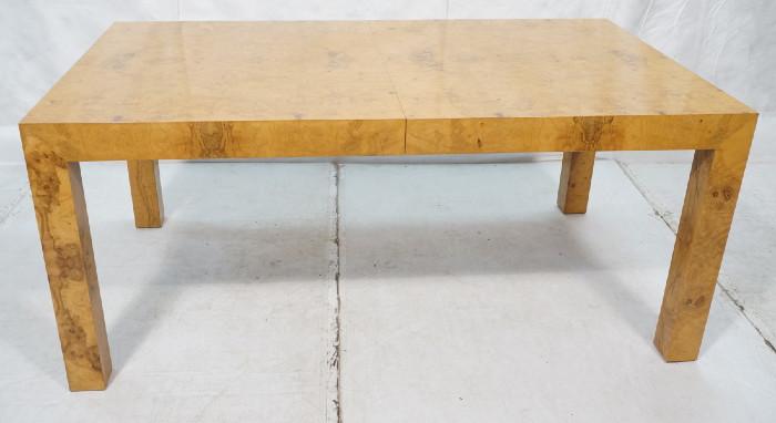 Lot 455  -  MILO BAUGHMAN Attributed DINING Table. Burled Wood with Thick square column legs. Two 22.5" Leaves. 3.5: thick skirt. Not Marked-- Dimensions:  H: 28.75 inches: W: 66 inches: D: 39 inches --- 