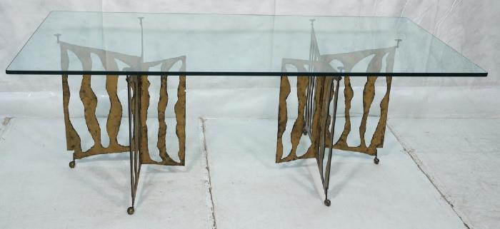 Lot 457  -  SILAS SEANDEL style Dining Table. 3/4" thick glass on cut steel base. Gilt Brutalist Form. Not marked-- Dimensions:  H: 30 inches: D: 42.25 inches: L: 84 inches --- 