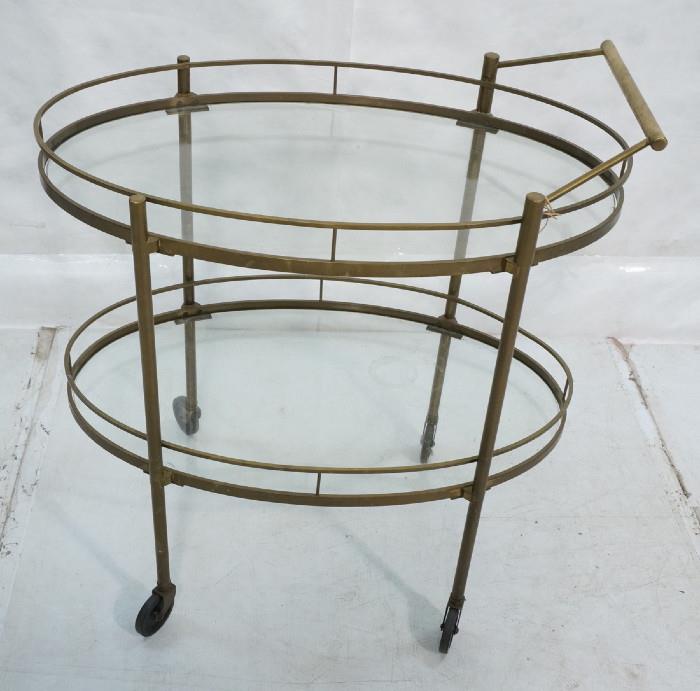 Lot 458  -  Decorator Brass & Glass Bar Cart. Inset Oval Glass. Thick Brass Construction.-- Dimensions:  H: 33.5 inches: W: 30.5 inches: D: 18.5 inches --- 