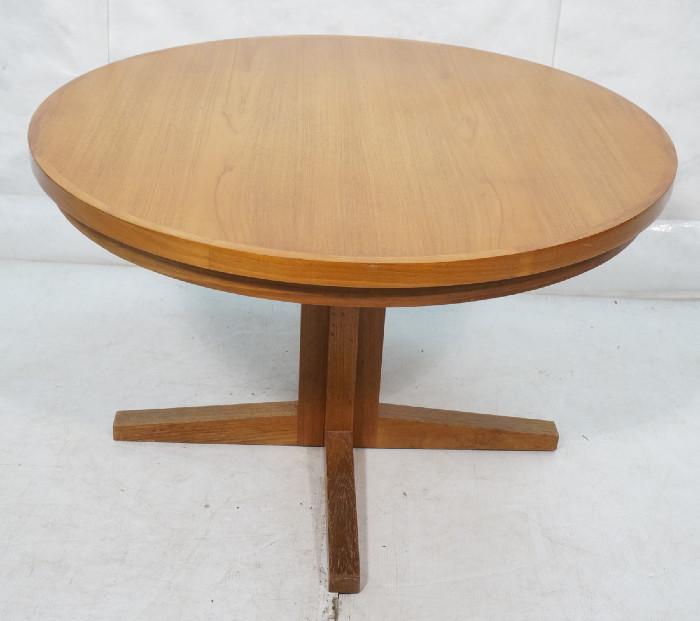 Lot 460  -  DYRLUND Danish Teak Dining Table. Unique Round Refractory Table. Lift Out Leaves flip open so table remains round when leaves are used. Marked-- Dimensions:  H: 28 inches: W: 45 inches: D: 45 inches --- 