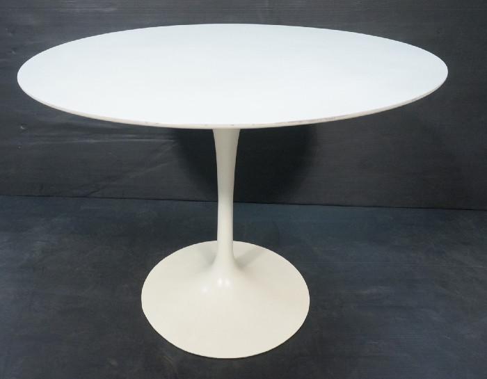 Lot 466  -  EERO SAARINEN Tulip Dining Table. White Laminate Top. KNOLL Attribution. Heavy Iron Base. -- Dimensions:  H: 28.5 inches: W: 36 inches: D: 36 inches --- 