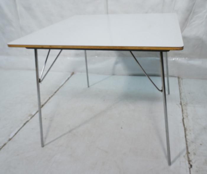 Lot 467  -  Vintage HERMAN MILLER Folding Table. Charles Eames. White Laminate Top. Chrome Folding Legs. This is an older model.-- Dimensions:  H: 28.5 inches: W: 34 inches: D: 34 inches --- 