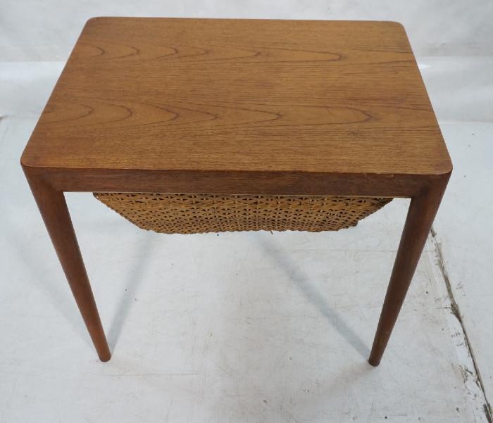 Lot 472  -  Danish Modern Sewing Side Table. Teak. Woven wicker basket. GEORGE TANIER, marked. Tapered peg legs.-- Dimensions:  H: 20.75 inches: W: 23.25 inches: D: 17.25 inches --- 