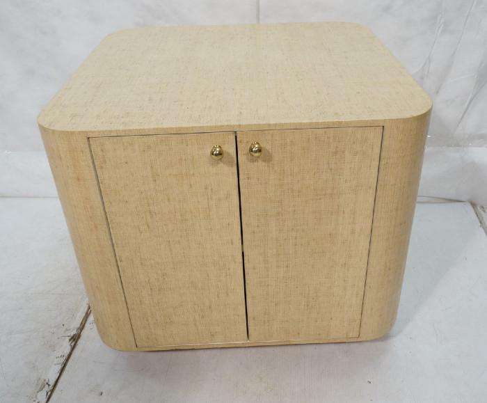 Lot 475  -  SPRINGER style Grass Cloth Covered Table Cabinet. Two doors with brass pulls. White interior. -- Dimensions:  H: 26 inches: W: 30.25 inches: D: 31.25 inches --- 