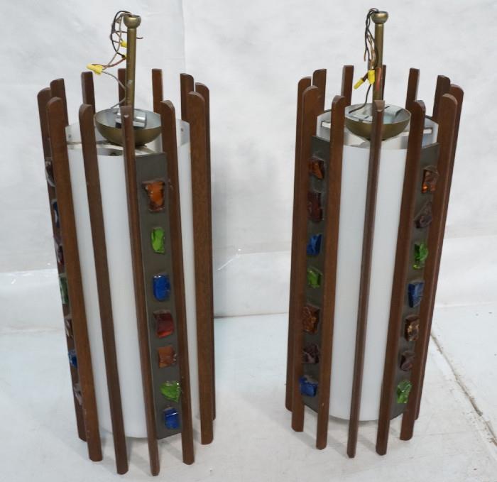 Lot 477  -  Pr 70's Modern Walnut Cylinder Hanging Lamps. Walnut slats on white plastic cylinder form. Applied Brutalist chunks of colored glass. Hanging lights-- Dimensions:  H: 36 inches: W: 12 inches --- 