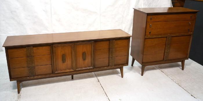 Lot 482  -  2pc American Modern Walnut Credenza & Tall Chest. Carved Details to Wood Pulls. Raised on Legs. Beveled Overhang Tops. Credenza has two doors (three interior drawers) & six drawers.-- Dimensions:  H: 30 inches: D: 19 inches: L: 74 inches --- 
