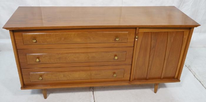 Lot 485  -  American Modern Credenza Sideboard. Walnut. Brass Pulls. Three Drawers. One Door. Raised on tapered peg legs. Curved Front. Marked Hudson. -- Dimensions:  H: 32 inches: D: 21 inches: L: 62.5 inches --- 