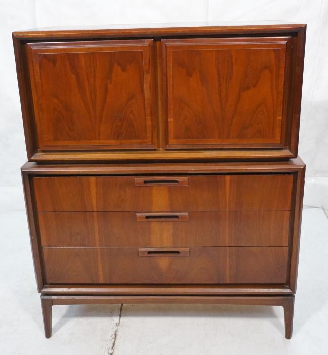 Lot 491  -  American Modern Gentleman's Chest Dresser. Two doors over three drawers. Wood pulls-- Dimensions:  H: 51 inches: W: 42 inches: D: 19 inches --- 