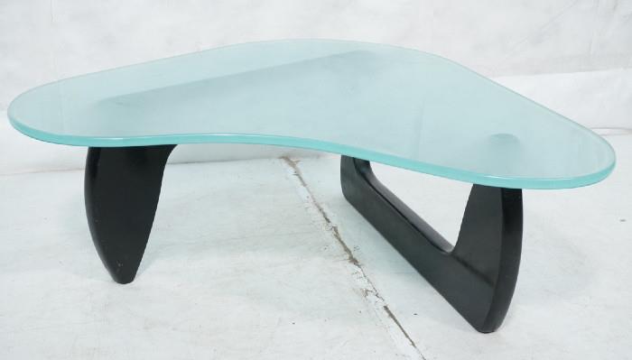 Lot 501  -  Frosted Glass Modernist Wood Cocktail Table. 3/4" thick biomorphic shaped frosted glass top. NOGUCHI ebonized wood base. -- Dimensions:  H: 16 inches: W: 43 inches: D: 40.5 inches --- 