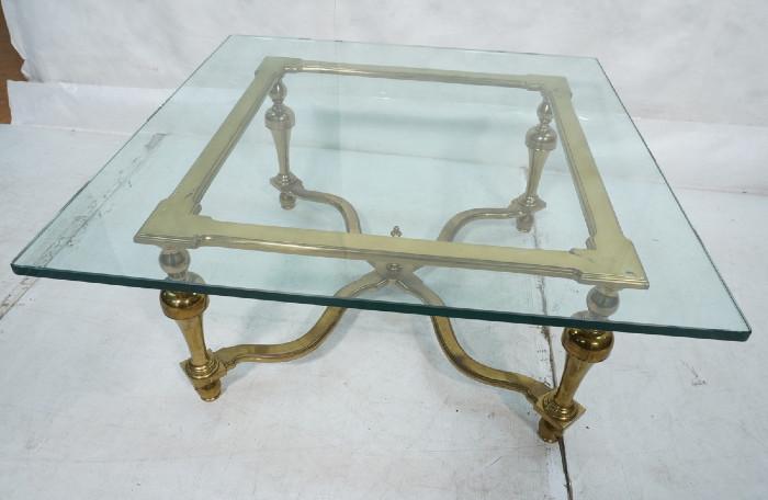 Lot 504  -  Decorator Mastercraft style Coffee Table. 3/4" thick glass top on brass frame cocktail table.-- Dimensions:  H: 17.25 inches: W: 38 inches: D: 38 inches --- 