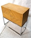 Lot 523  -  BAUGHMAN style Rattan & Chrome Two Drawer Cabinet. On square rod chrome base.-- Dimensions:  H: 26 inches: W: 25.75 inches: D: 13.75 inches --- 