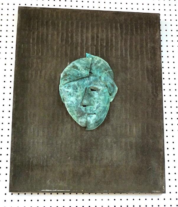 Lot 525  -  Brutalist style wall Sculpture. Green patina bronze. Abstract face on cement gesso background. Signed MICHAEL HORN.-- Dimensions:  H: 30.5 inches: W: 29 inches --- 