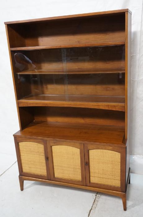 Lot 531  -  American Modern Walnut China Cabinet. Bookcase top over caned door base cabinet. -- Dimensions:  H: 69 inches: W: 44.25 inches: D: 17.25 inches --- 