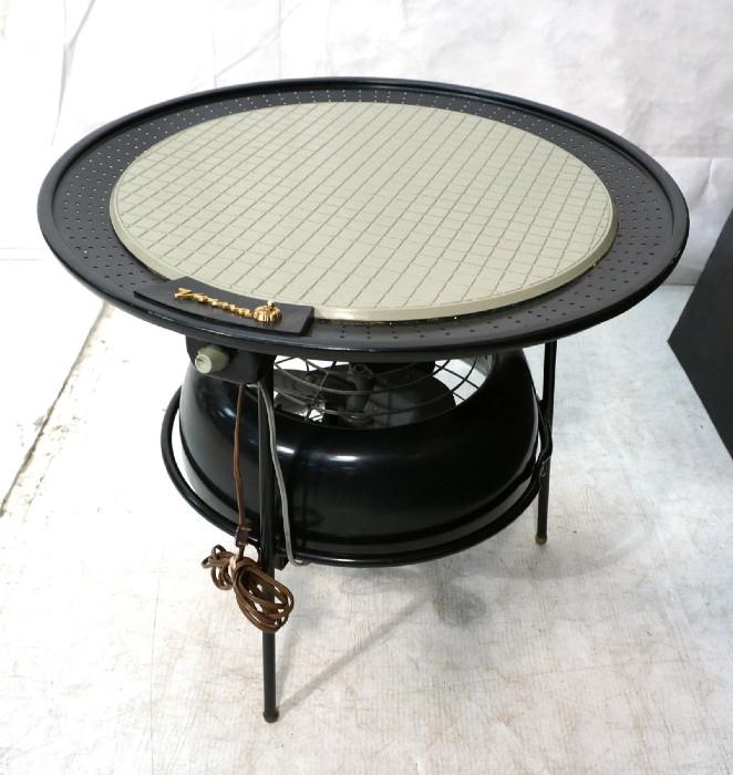 Lot 532  -  VORNADO Table Fan. Black metal frame casing. Light gray plastic top. Fan pivots. -- Dimensions:  H: 19.75 inches: W: 22 inches: D: 22 inches --- 