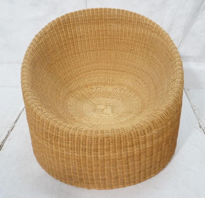 Lot 464  -  EERO AARNIO Woven Wicker Lounge Chair. Round form with concave seat-- Dimensions:  H: 26 inches: W: 32 inches: D: 34 inches --- 