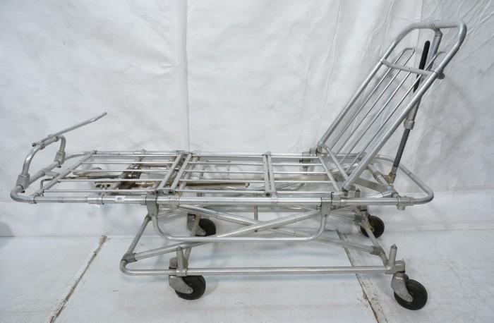 Lot 543  -  Industrial Aluminum Gurney. Rolling. Adjustable height & back-- Dimensions:  H: 43 inches: D: 23 inches: L: 63 inches --- 