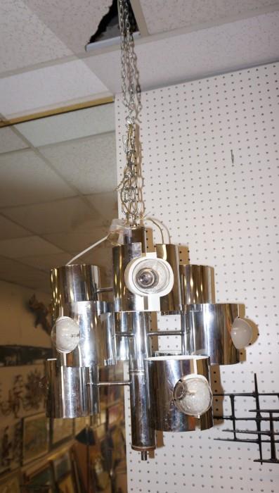 Lot 544  -  70's Modern Chrome Hanging Light Chandelier. Nine arms. Cylinder chrome shades with inset bulbs. -- Dimensions:  H: 16 inches: W: 16 inches: D: 16 inches --- 