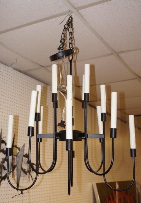 Lot 547  -  Eight Arm Black Metal Chandelier. 16 candle lights. -- Dimensions:  H: 26.5 inches: W: 24 inches: D: 24 inches --- 