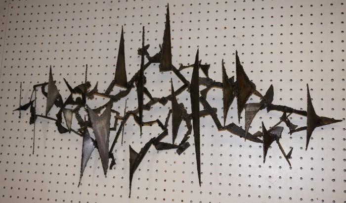 Lot 549  -  Brutalist Iron Triangle & Arrow Wall Sculpture. -- Dimensions:  H: 21 inches: W: 37 inches: D: 3 inches --- 
