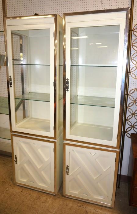 Lot 567  -  Pr Decorator Display Cabinets. Glass doors and sides display area above lattice front bases. Chrome trim and hardware. Electrified.-- Dimensions:  H: 78 inches: W: 23 inches: D: 18 inches --- 