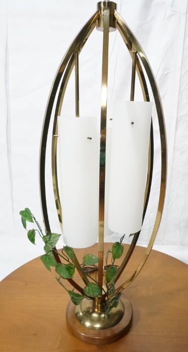 Lot 573  -  Modernist Brass Table Lamp. Elliptical shape with three hanging milk glass cylinder shades. -- Dimensions:  H: 38 inches: W: 15 inches --- 