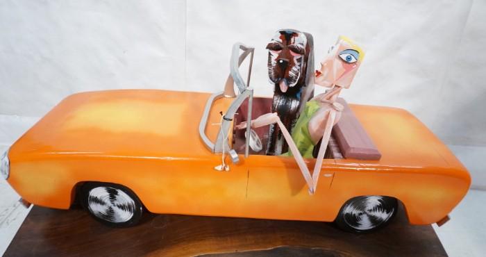 Lot 580  -  DERR Signed Polychrome Wood Car Sculpture. "BAMBI & BOZWELL" Signed & Dated '05. Discovery Gallery Tag. -- Dimensions:  H: 33.5 inches: W: 16 inches: D: 11 inches --- 