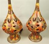 Lot 596  -  Pr Pottery Pierced Table Lamps. Wood base. Gold, red & brown glaze. -- Dimensions:  H: 34 inches: W: 11 inches: D: 11 inches --- 