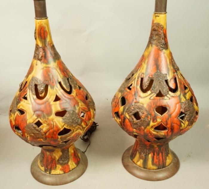 Lot 596  -  Pr Pottery Pierced Table Lamps. Wood base. Gold, red & brown glaze. -- Dimensions:  H: 34 inches: W: 11 inches: D: 11 inches --- 