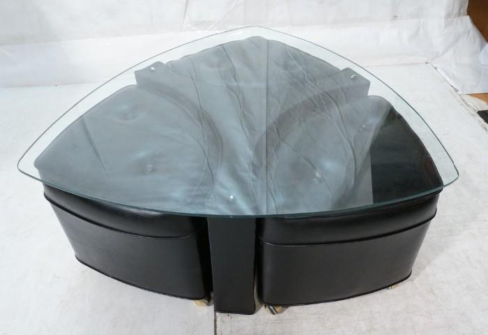 Lot 615  -  Glass Top Coffee Table with Three Triangle Nesting Stools. Black tufted leather stools. Triangle shaped glass on black leather three part base. Stools are on casters.-- Dimensions:  H: 17 inches: W: 39 inches: D: 39 inches --- 