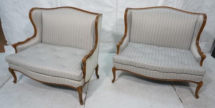 Lot 634  -  Pr French Provincial High Back Love Seats. Carved wood frames with cabriole legs. Striped fabric. -- Dimensions:  H: 40 inches: W: 46 inches: D: 28 inches --- 