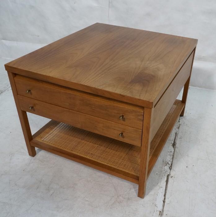 Lot 643  -  PAUL McCOBB Calvin Series Two Drawer End Table. Night Stand. Metal pulls. Caned lower shelf. Marked. -- Dimensions:  H: 19 inches: W: 24 inches: D: 28 inches --- 