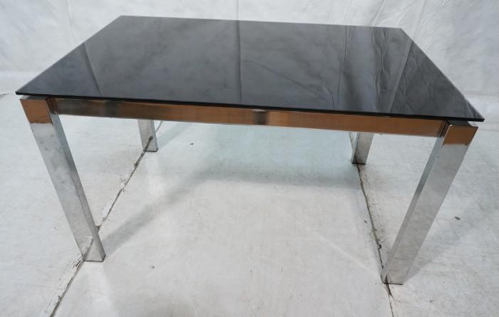 Lot 652  -  Chrome Rectangular Dining Table. Black Glass Top. Hidden Glass Leaves. Thick chrome square column legs.-- Dimensions:  H: 29.75 inches: W: 33.5 inches: D: 51.25 inches --- 