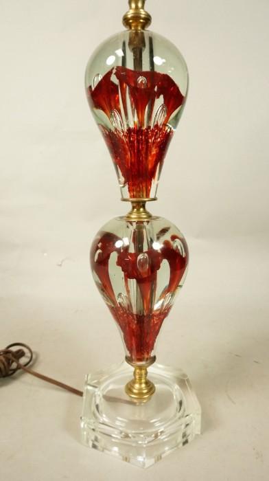 Lot 513  -  Blown Art Glass Table Lamp.  Red and clear.  Floral design.  Heavy glass center.  Matching glass finial.-- Dimensions:  H: 32 inches --- 